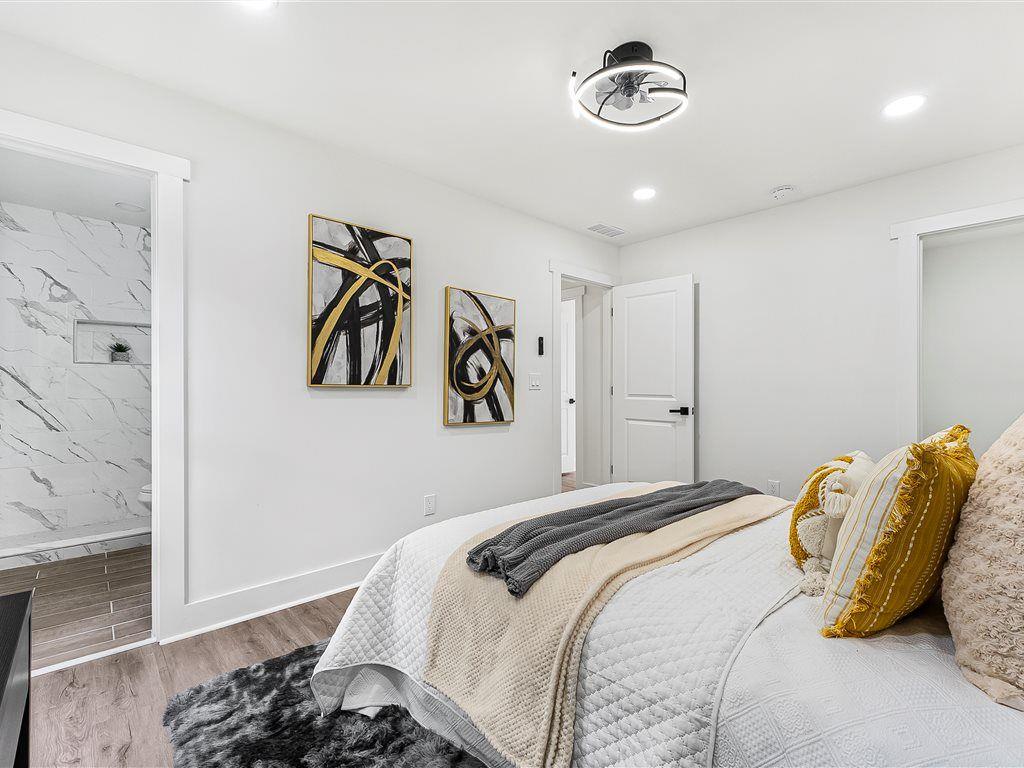 531 Carlton Road Palmetto, GA 30268 - Photo 25 of 38 a bedroom with a bed and a wooden floor