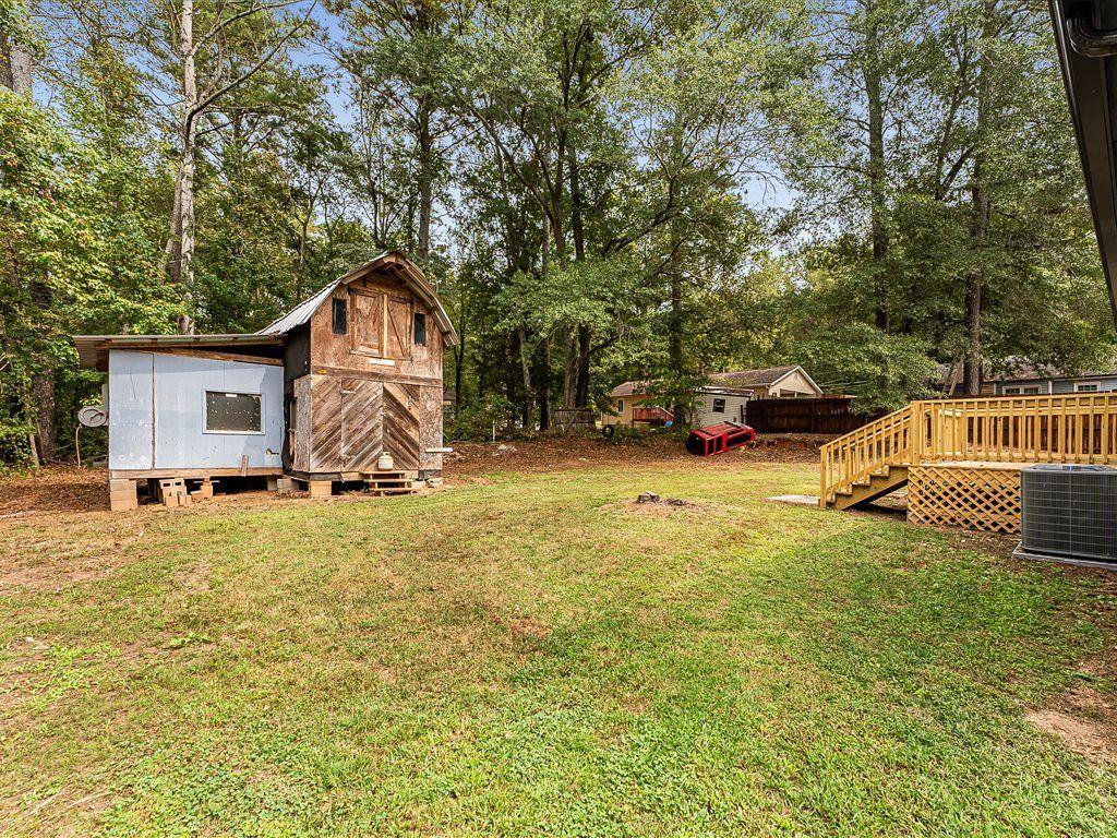 531 Carlton Road Palmetto, GA 30268 - Photo 30 of 38 a view of a house with a yard and sitting area