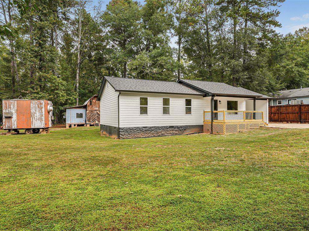 531 Carlton Road Palmetto, GA 30268 - Photo 35 of 38 a view of a house with a backyard
