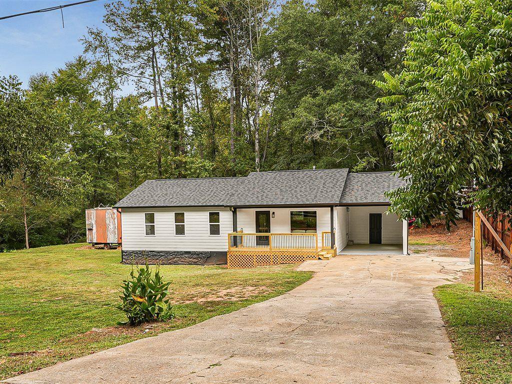 531 Carlton Road Palmetto, GA 30268 - Photo 36 of 38 a front view of a house with garden