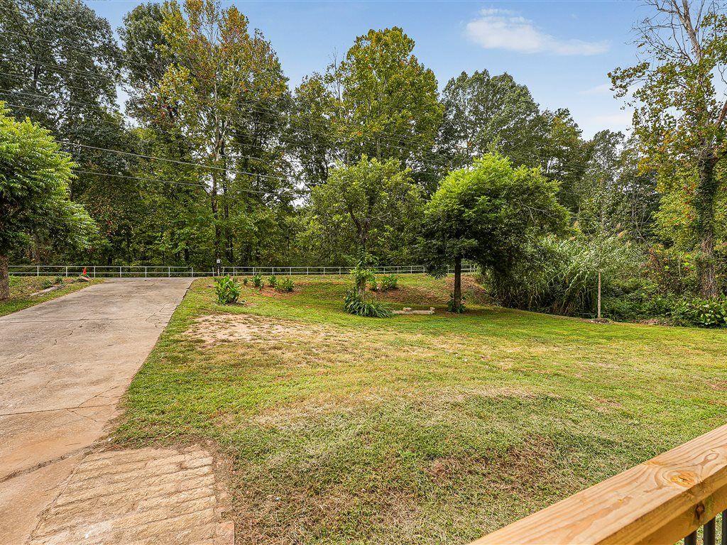531 Carlton Road Palmetto, GA 30268 - Photo 37 of 38 a view of a swimming pool with a yard