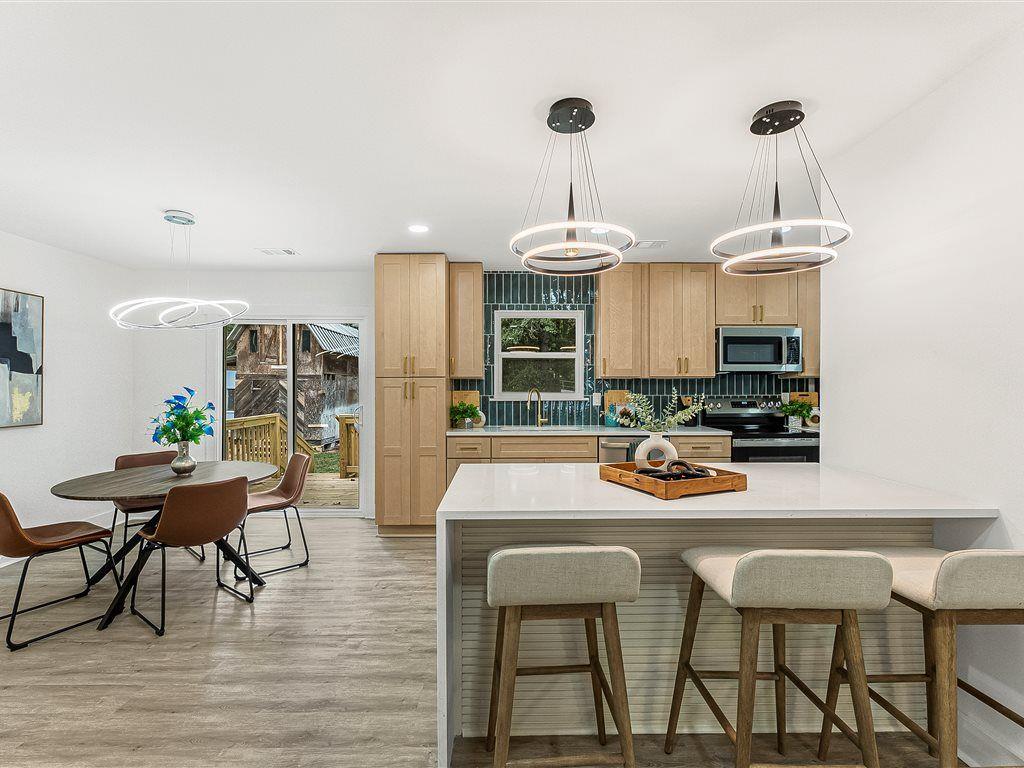 531 Carlton Road Palmetto, GA 30268 - Photo 9 of 38 a view of a dining room with furniture and wooden floor