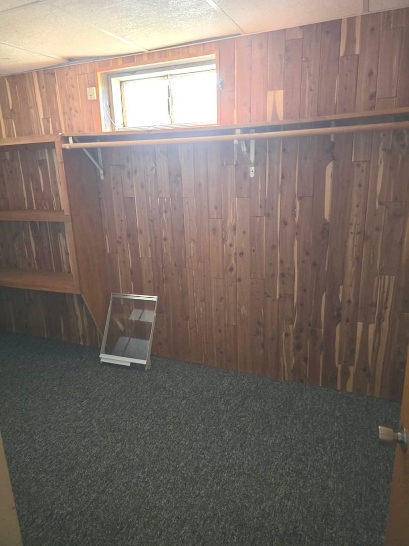 827 South McKinley Avenue Kankakee, IL 60901 - Photo 26 of 30 a view of an empty room with wooden floor
