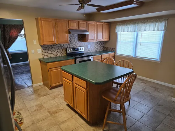 a view of an empty room and fire place