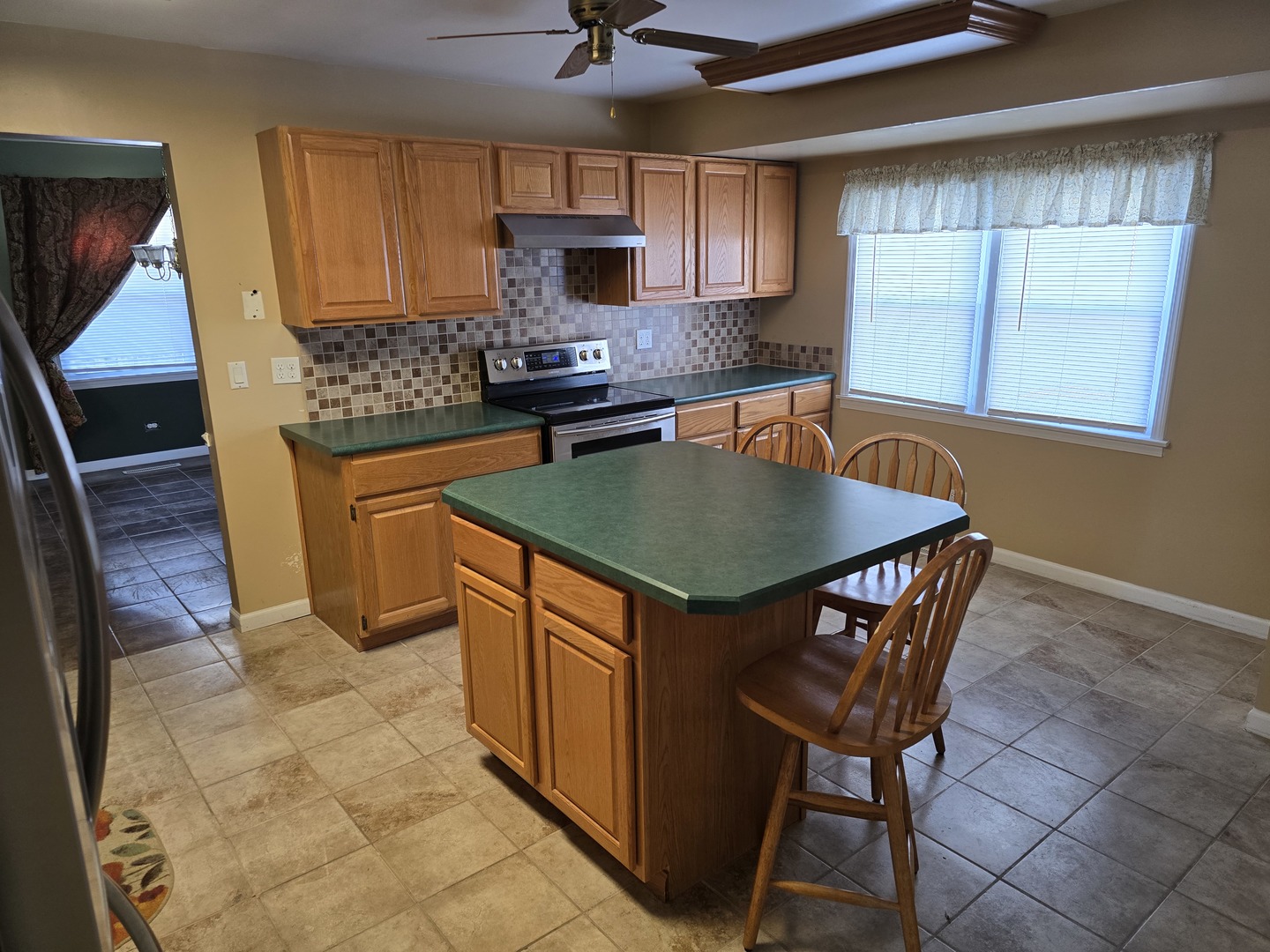 827 South McKinley Avenue Kankakee, IL 60901 - Photo 8 of 30 a kitchen with stainless steel appliances granite countertop a sink a stove a microwave a counter top space and cabinets