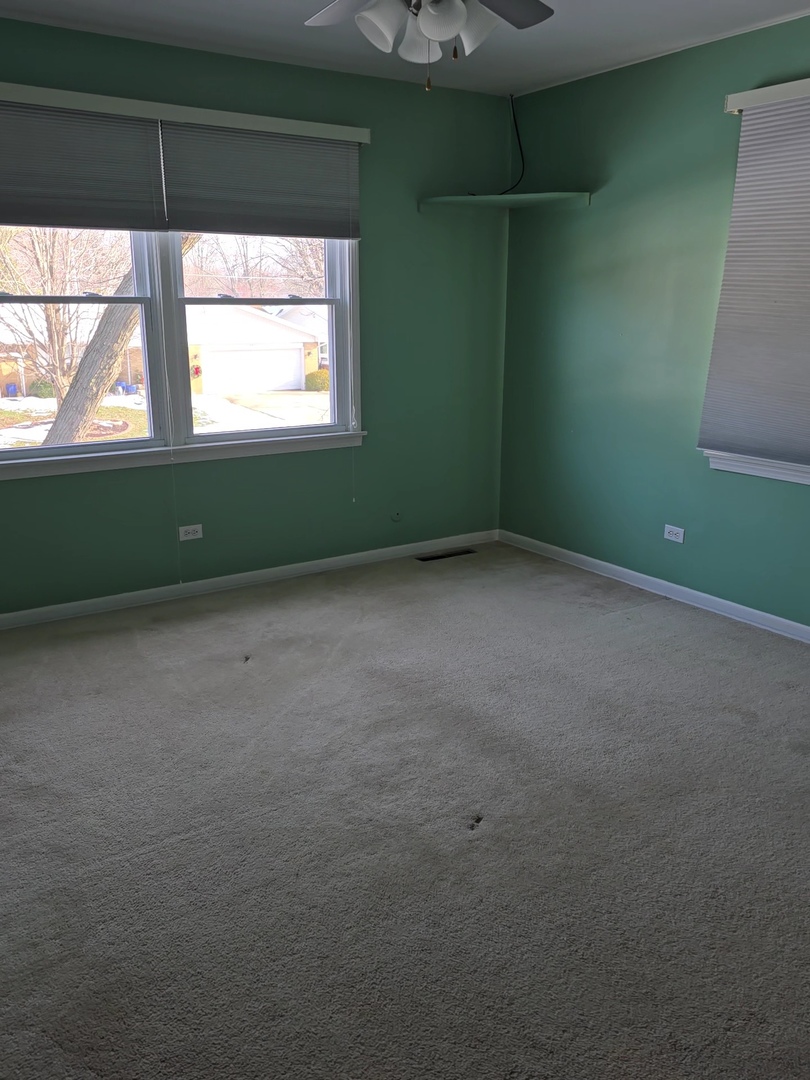 827 South McKinley Avenue Kankakee, IL 60901 - Photo 10 of 13 a view of an empty room with a window
