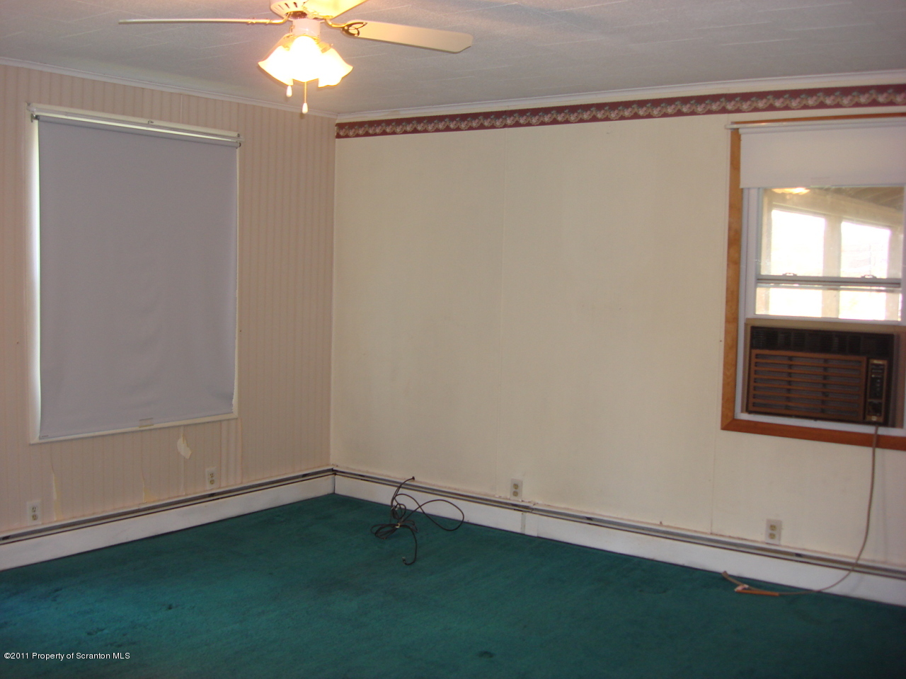 2929 Lower Demunds Road Dallas, PA 18612 - Photo 2 of 8 a room that has a window in it