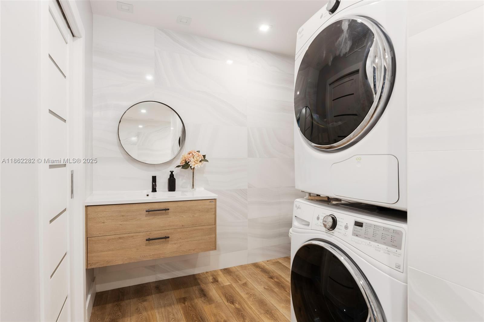 2451 Brickell Avenue, Unit 21D Miami, FL 33129 - Photo 13 of 21 a view of a hallway with washer and dryer
