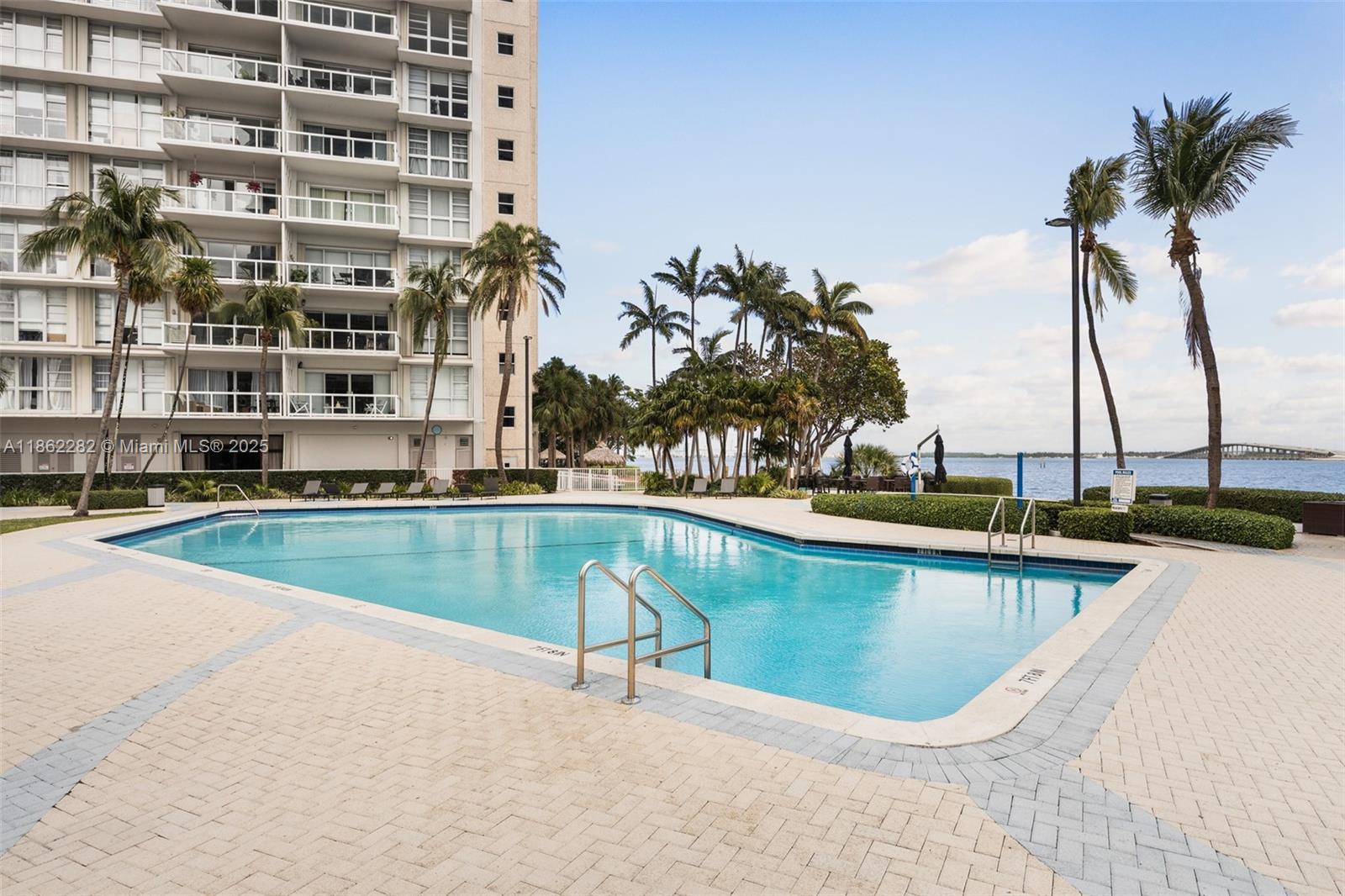 2451 Brickell Avenue, Unit 21D Miami, FL 33129 - Photo 20 of 21 a view of swimming pool with outdoor seating and plants