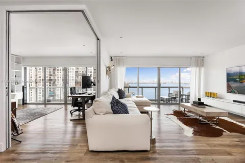 a living room with furniture and a table