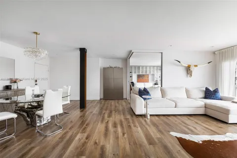 a living room with furniture or couch and a wooden floor