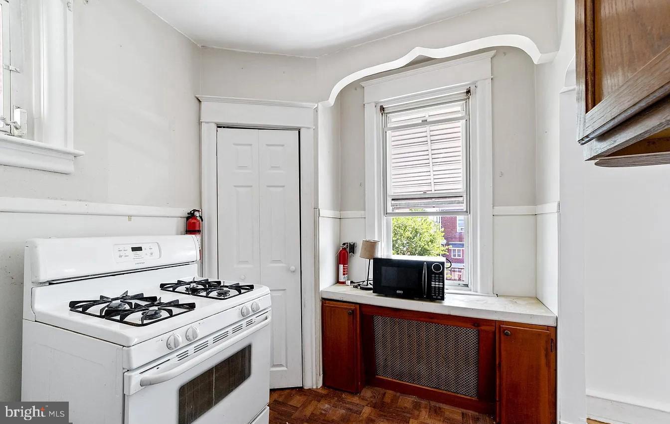 2329 Rhawn Street Philadelphia, PA 19152 - Photo 23 of 23 a kitchen with a stove a sink and a refrigerator