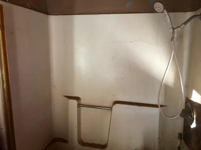 a swimming pool with wooden fence