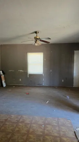 a view of an empty room and window