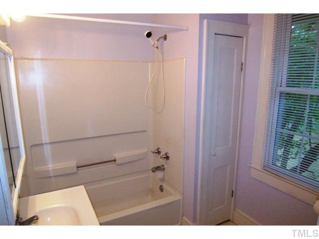 1807 Sunset Drive Raleigh, NC 27608 - Photo 7 of 10 a bathroom with a bathtub and shower