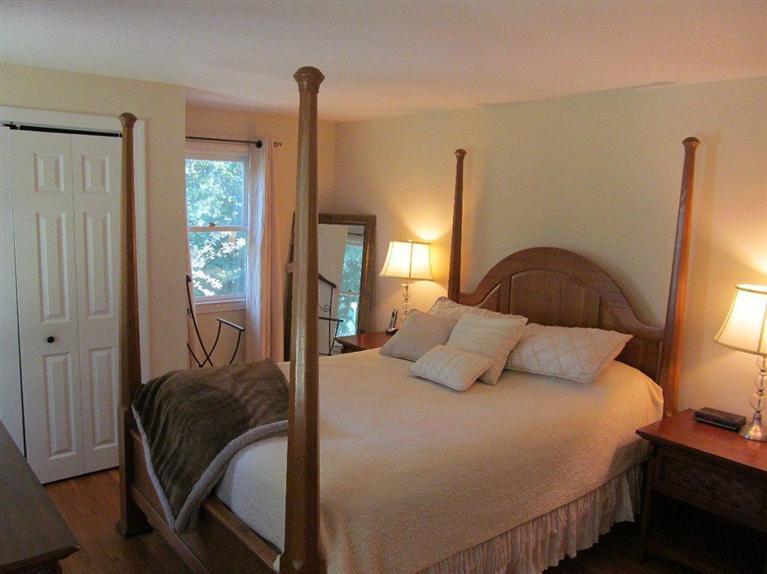 37 Valley Brook Road Centerville, MA 02632 - Photo 13 of 26 a bedroom with a bed and wooden floor