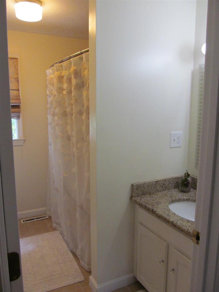 37 Valley Brook Road Centerville, MA 02632 - Photo 17 of 26 a bathroom with a granite countertop sink and vanity