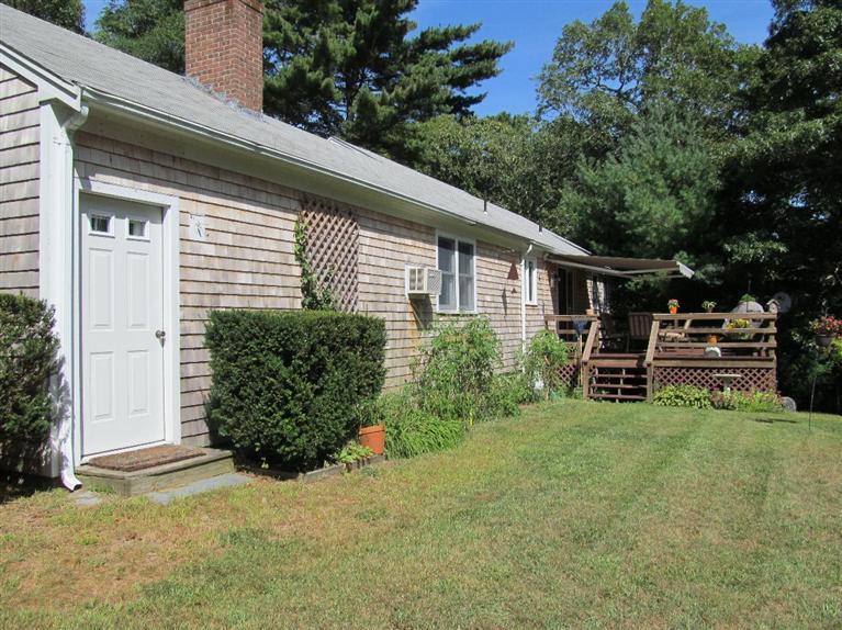 37 Valley Brook Road Centerville, MA 02632 - Photo 22 of 26 a view of a house with backyard and sitting area