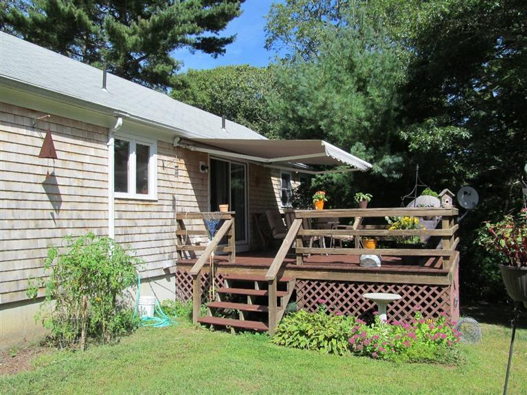 37 Valley Brook Road Centerville, MA 02632 - Photo 23 of 26 a front view of a house with garden