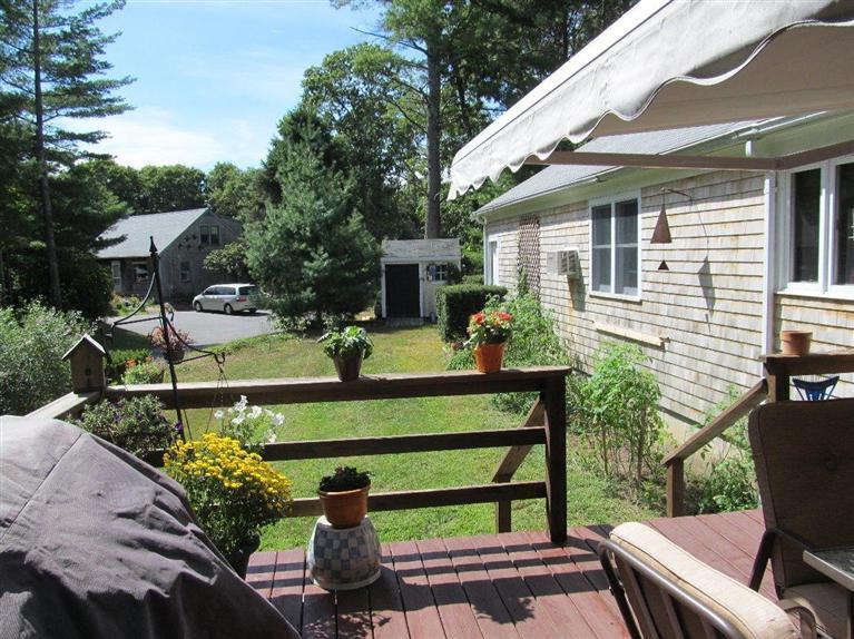 37 Valley Brook Road Centerville, MA 02632 - Photo 24 of 26 a view of a house with backyard and sitting area