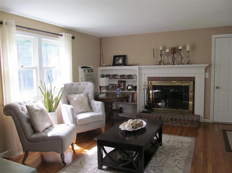 37 Valley Brook Road Centerville, MA 02632 - Photo 5 of 26 a living room with furniture and a fireplace