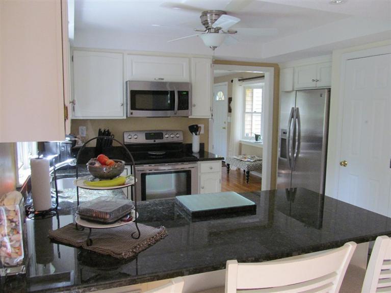 37 Valley Brook Road Centerville, MA 02632 - Photo 6 of 26 a kitchen with stainless steel appliances granite countertop a refrigerator and a stove top oven