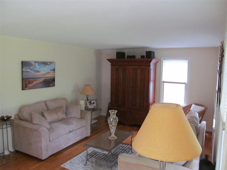 37 Valley Brook Road Centerville, MA 02632 - Photo 10 of 26 a living room with furniture a window and a lamp