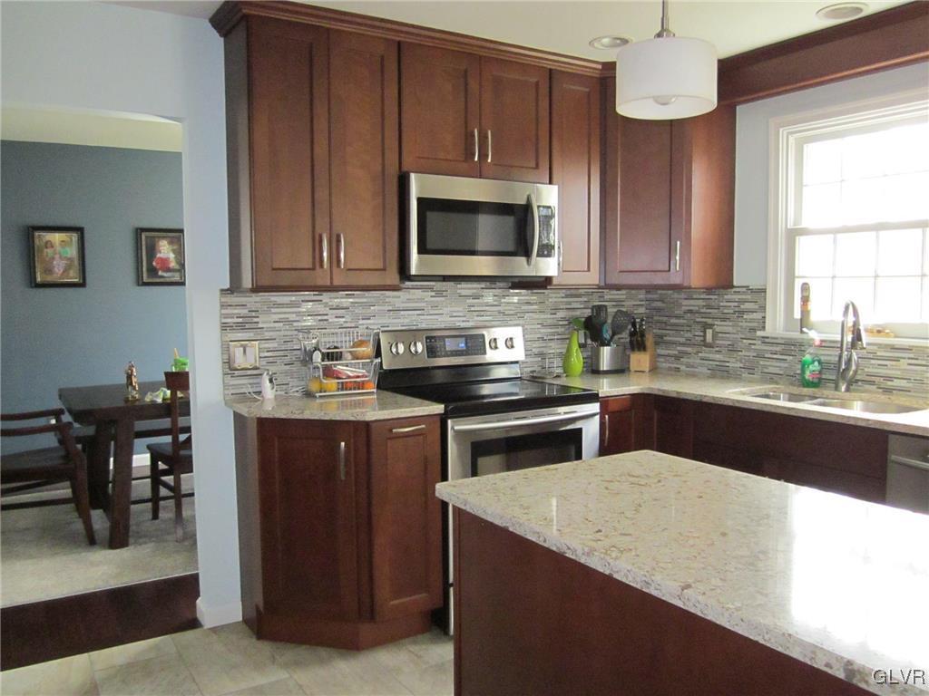421 Georgetown Road Nazareth, PA 18064 - Photo 6 of 24 a kitchen with a stove microwave and sink