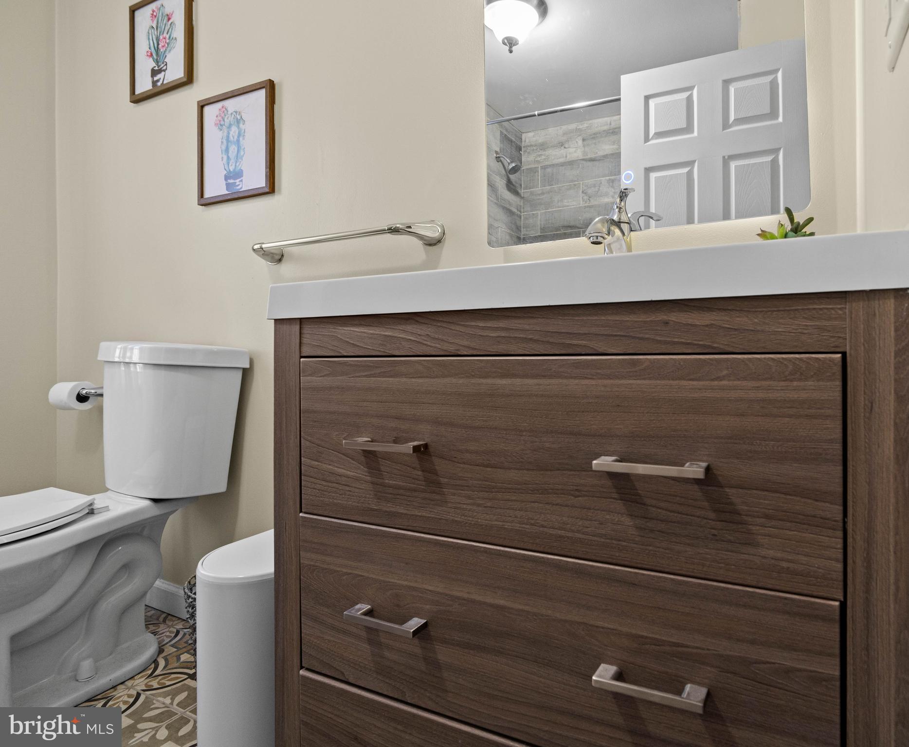 197 Ridge Street Smokerun, PA 16681 - Photo 34 of 47 a bathroom with a sink a toilet and a mirror
