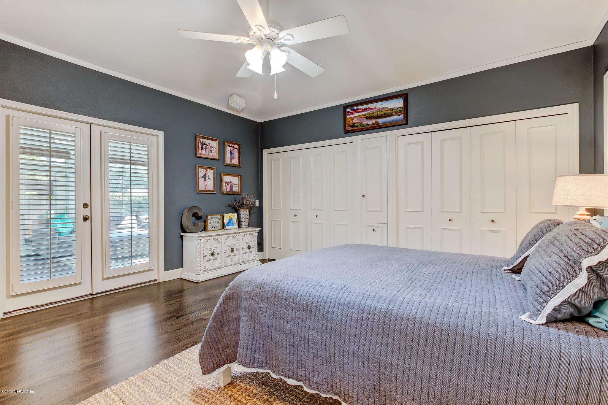 4121 London Road Jacksonville, FL 32207 - Photo 21 of 38 a spacious bedroom with a bed and a large window