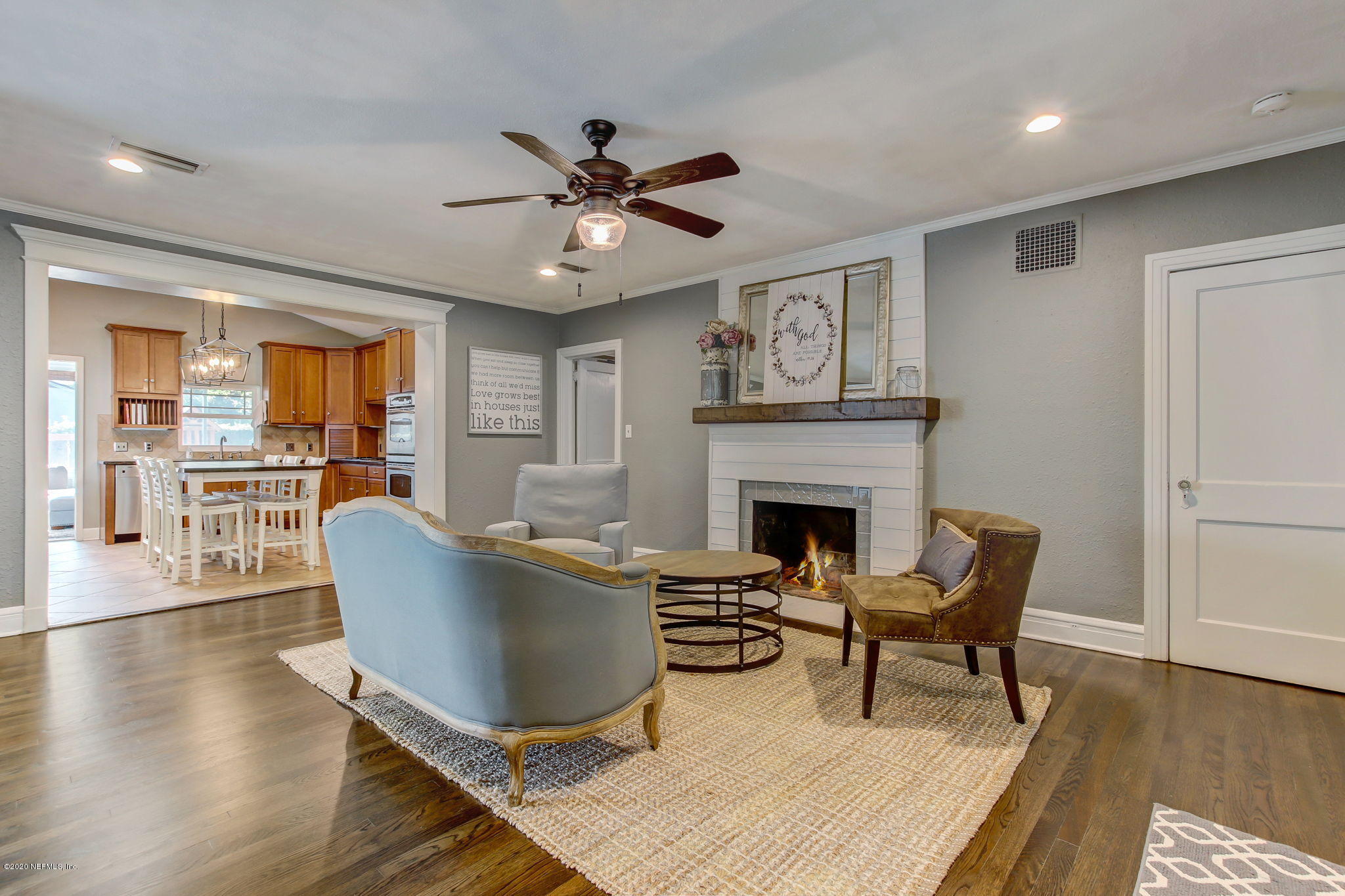 4121 London Road Jacksonville, FL 32207 - Photo 6 of 38 a living room with furniture a fireplace and a table