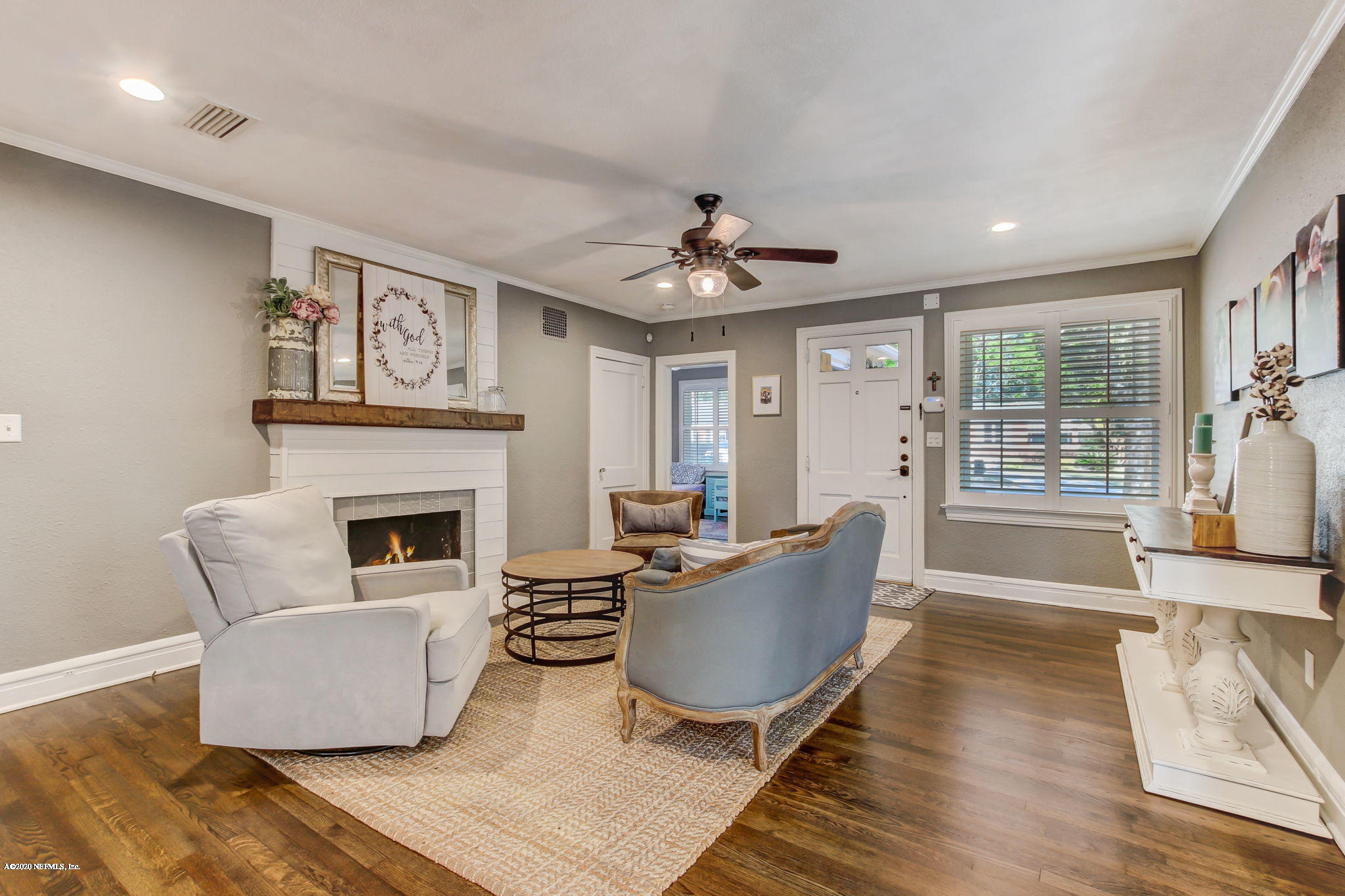 4121 London Road Jacksonville, FL 32207 - Photo 7 of 38 a living room with furniture a fireplace and a table
