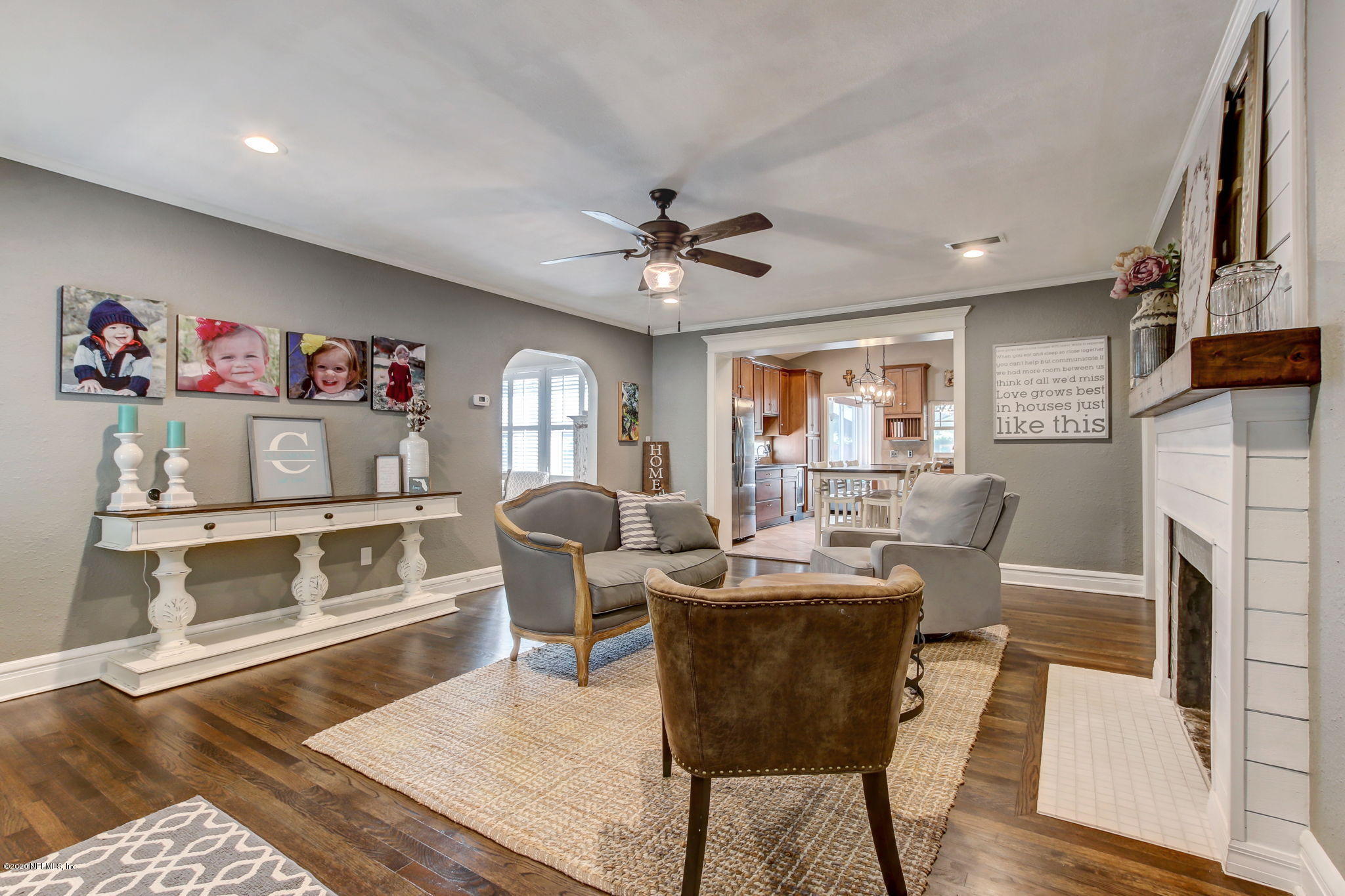 4121 London Road Jacksonville, FL 32207 - Photo 9 of 38 a living room with fireplace furniture and a flat screen tv