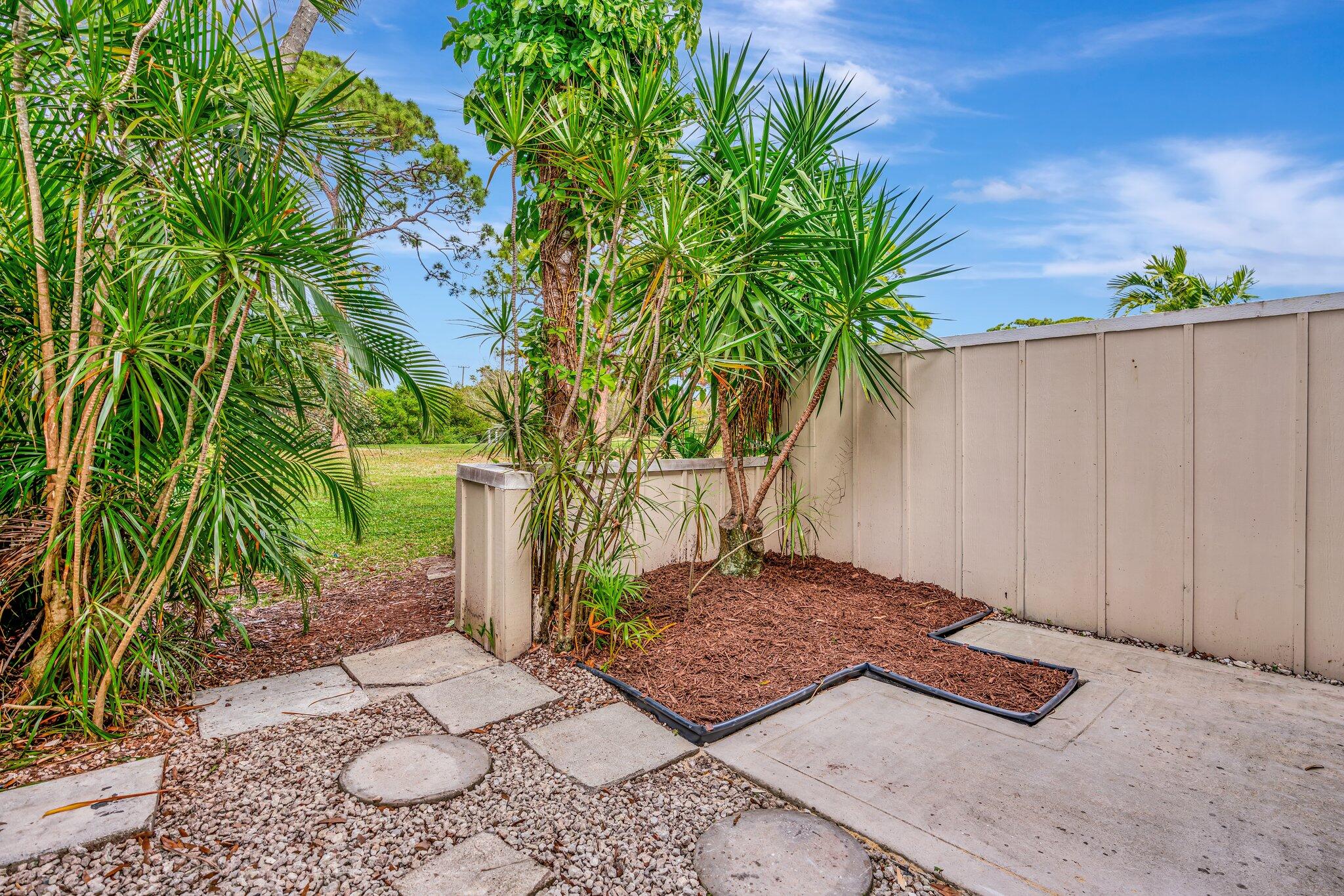 6327 Riverwalk Lane, Unit 4 Jupiter, FL 33458 - Photo 18 of 23 Back Patio