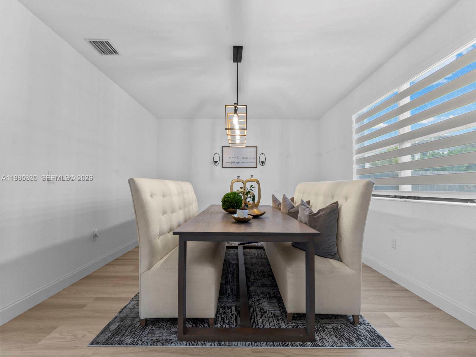 13391 Southwest 285th Street Homestead, FL 33033 - Photo 11 of 37 a dining room with furniture and window