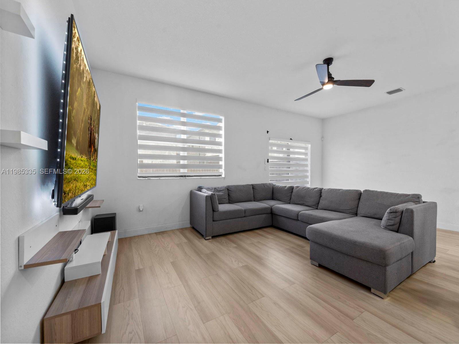 13391 Southwest 285th Street Homestead, FL 33033 - Photo 13 of 37 a living room with furniture and a window