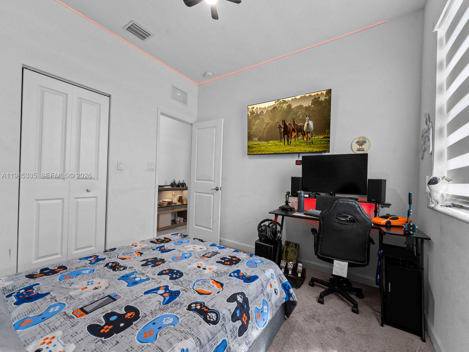 13391 Southwest 285th Street Homestead, FL 33033 - Photo 26 of 37 a bedroom with a bed and a flat screen tv