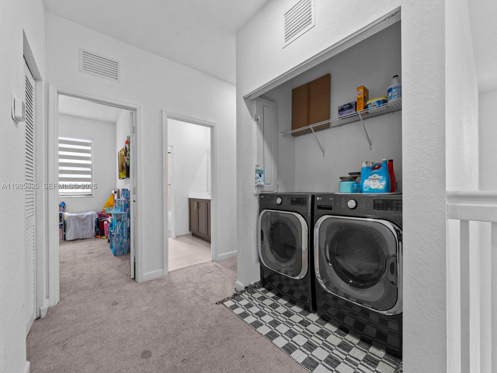 13391 Southwest 285th Street Homestead, FL 33033 - Photo 29 of 37 a view of a storage & utility room with washer and dryer