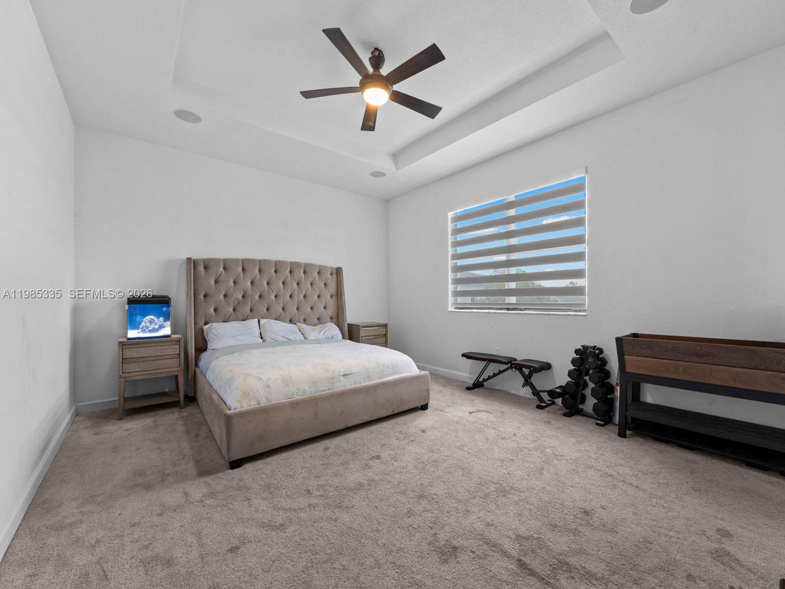 13391 Southwest 285th Street Homestead, FL 33033 - Photo 30 of 37 a bedroom with a bed a window and a couch