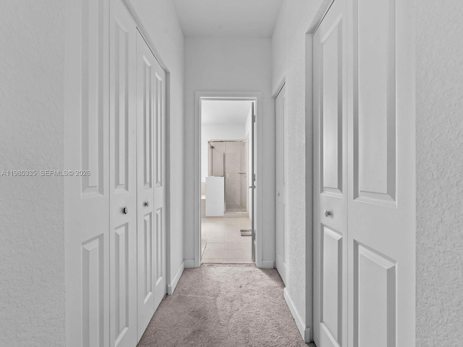 13391 Southwest 285th Street Homestead, FL 33033 - Photo 32 of 37 a view of a hallway with a wooden door
