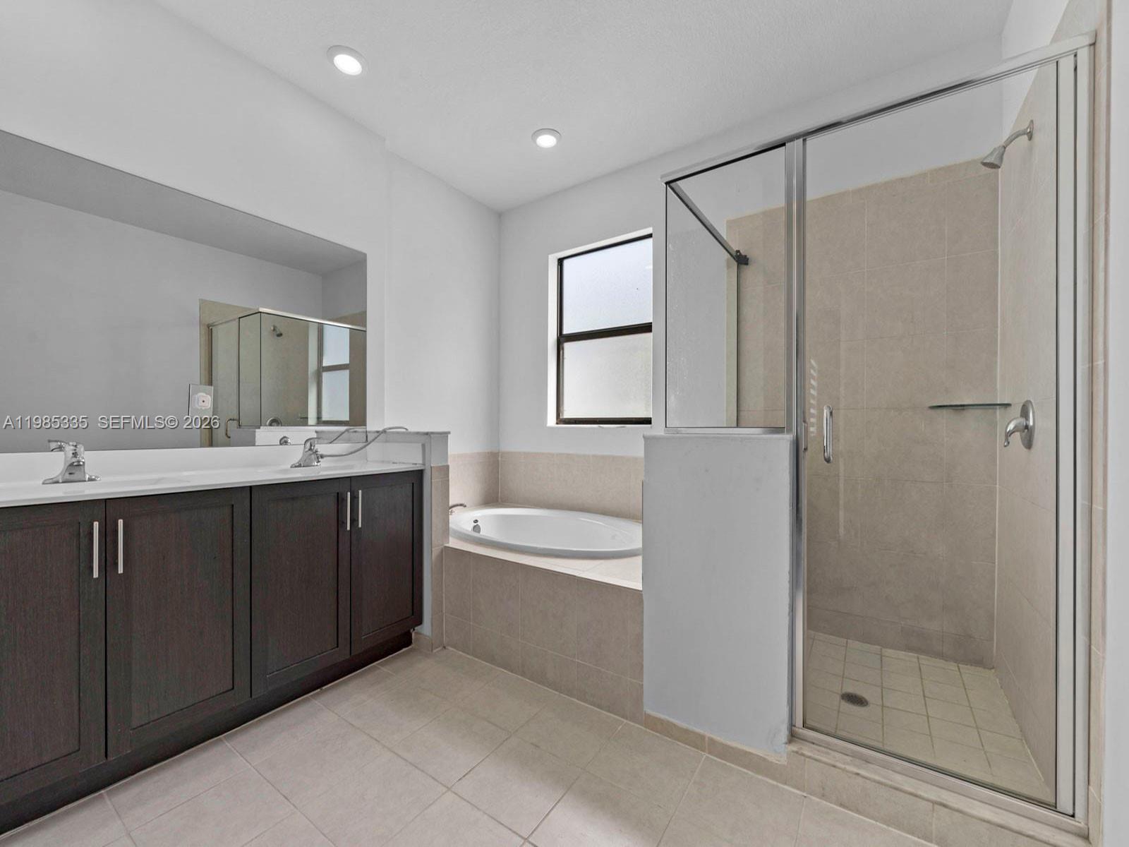 13391 Southwest 285th Street Homestead, FL 33033 - Photo 33 of 37 a bathroom with a bathtub shower sink mirror and toilet