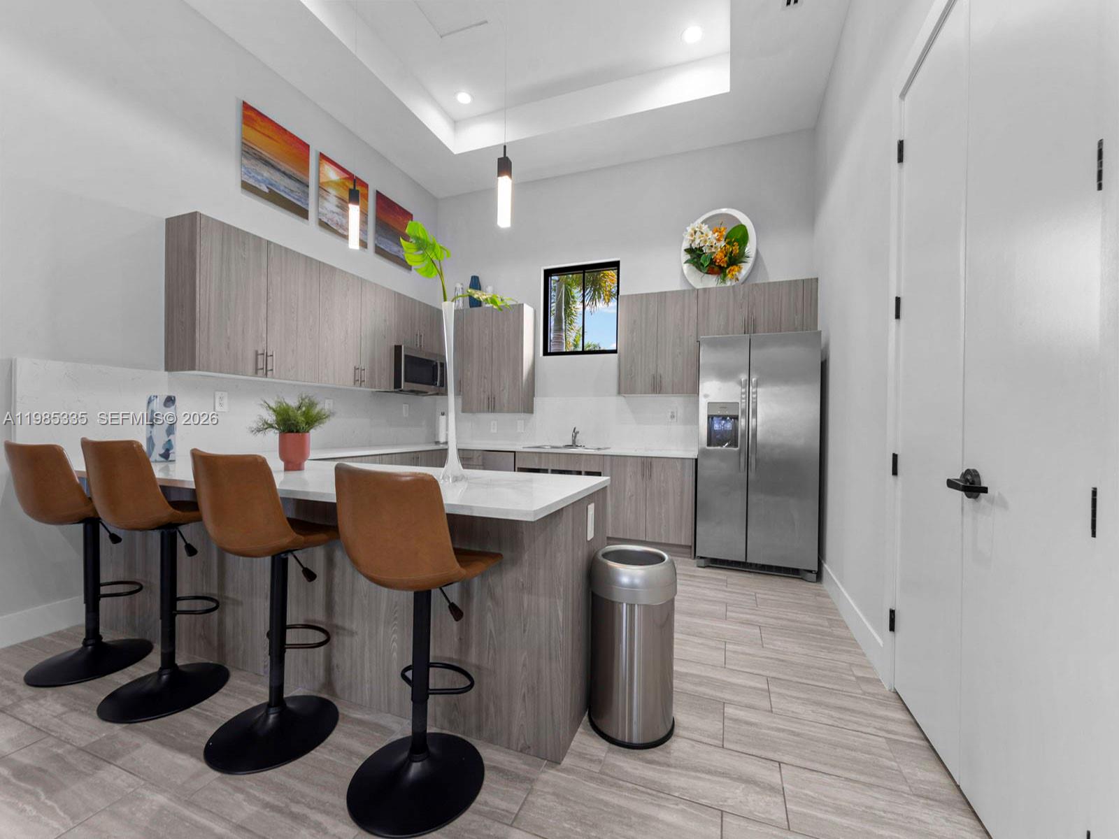 13391 Southwest 285th Street Homestead, FL 33033 - Photo 37 of 37 a kitchen with stainless steel appliances granite countertop a sink and a refrigerator