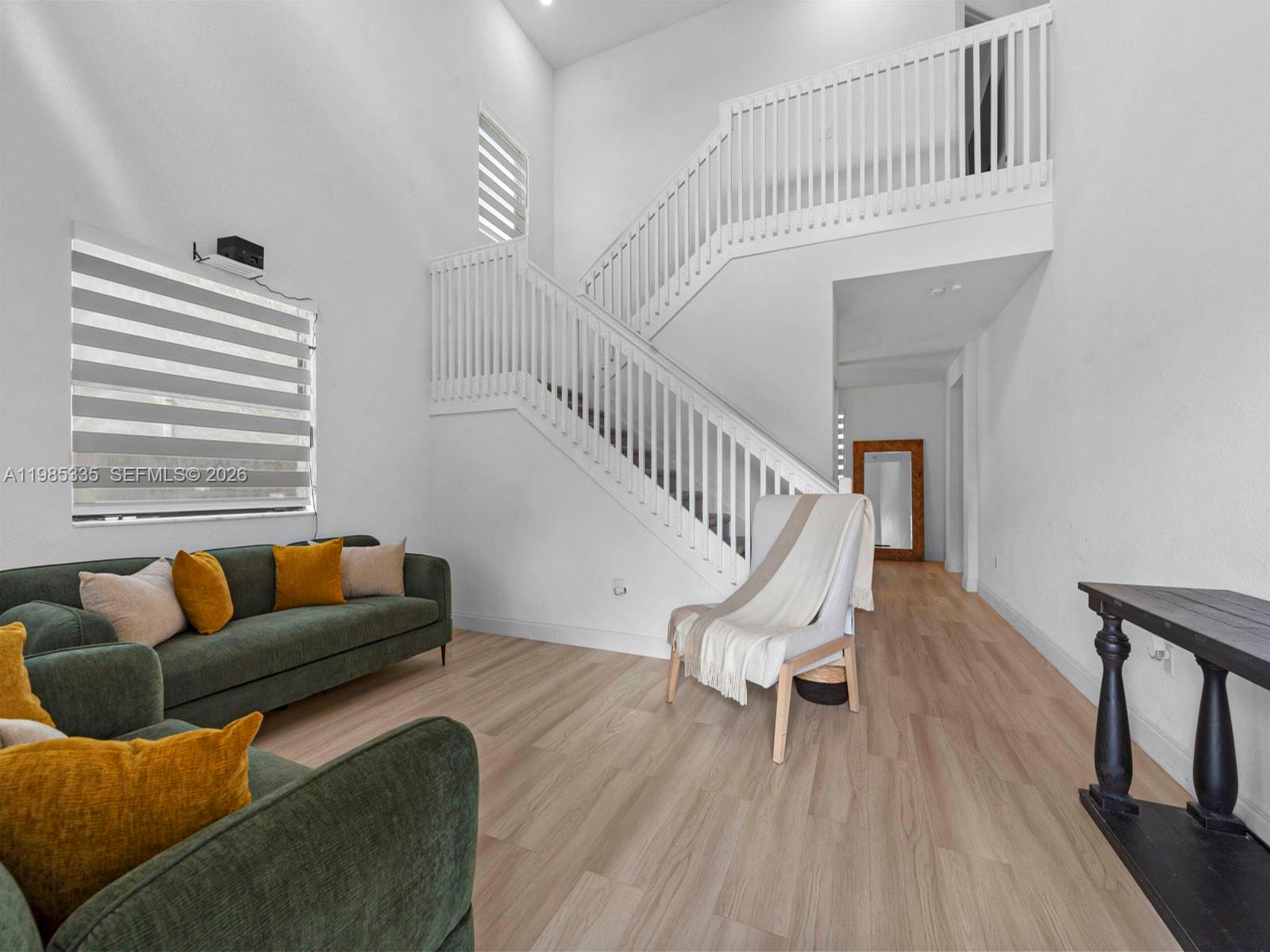 13391 Southwest 285th Street Homestead, FL 33033 - Photo 7 of 37 a living room with furniture and a wooden floor