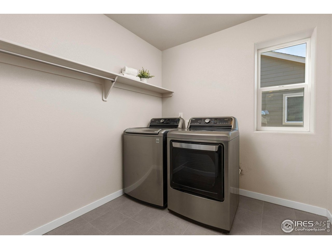 1223 Chilcott Street Berthoud, CO 80513 - Photo 18 of 38 Upstairs Laundry Room with Included Washer and Dryer