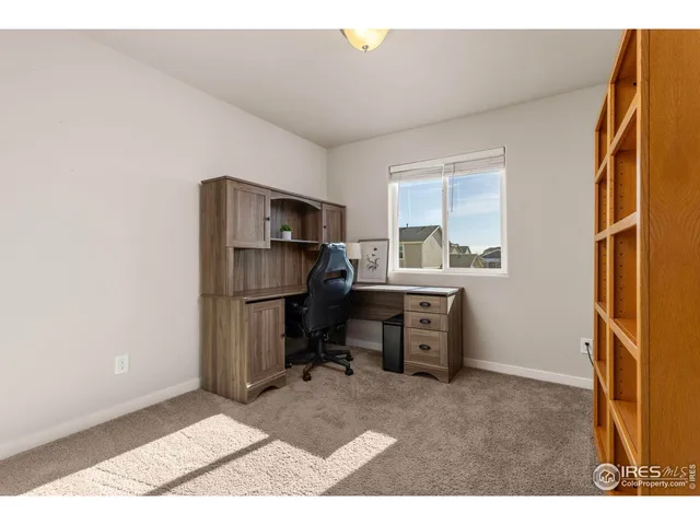 a workspace with furniture and a window