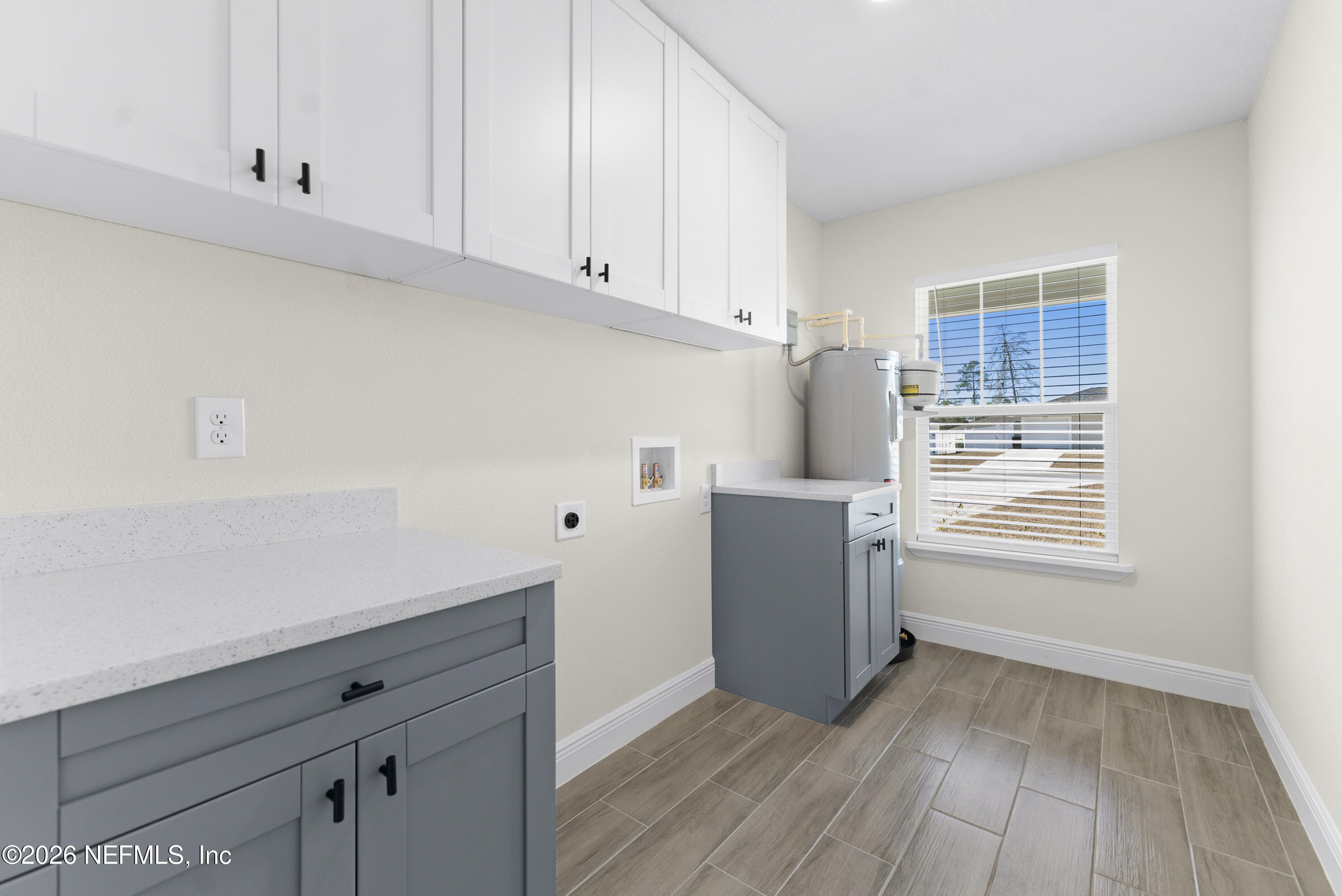 16521 Southwest 31st Terrace Ocala, FL 34473 - Photo 20 of 40 Laundry room with wood cabinets