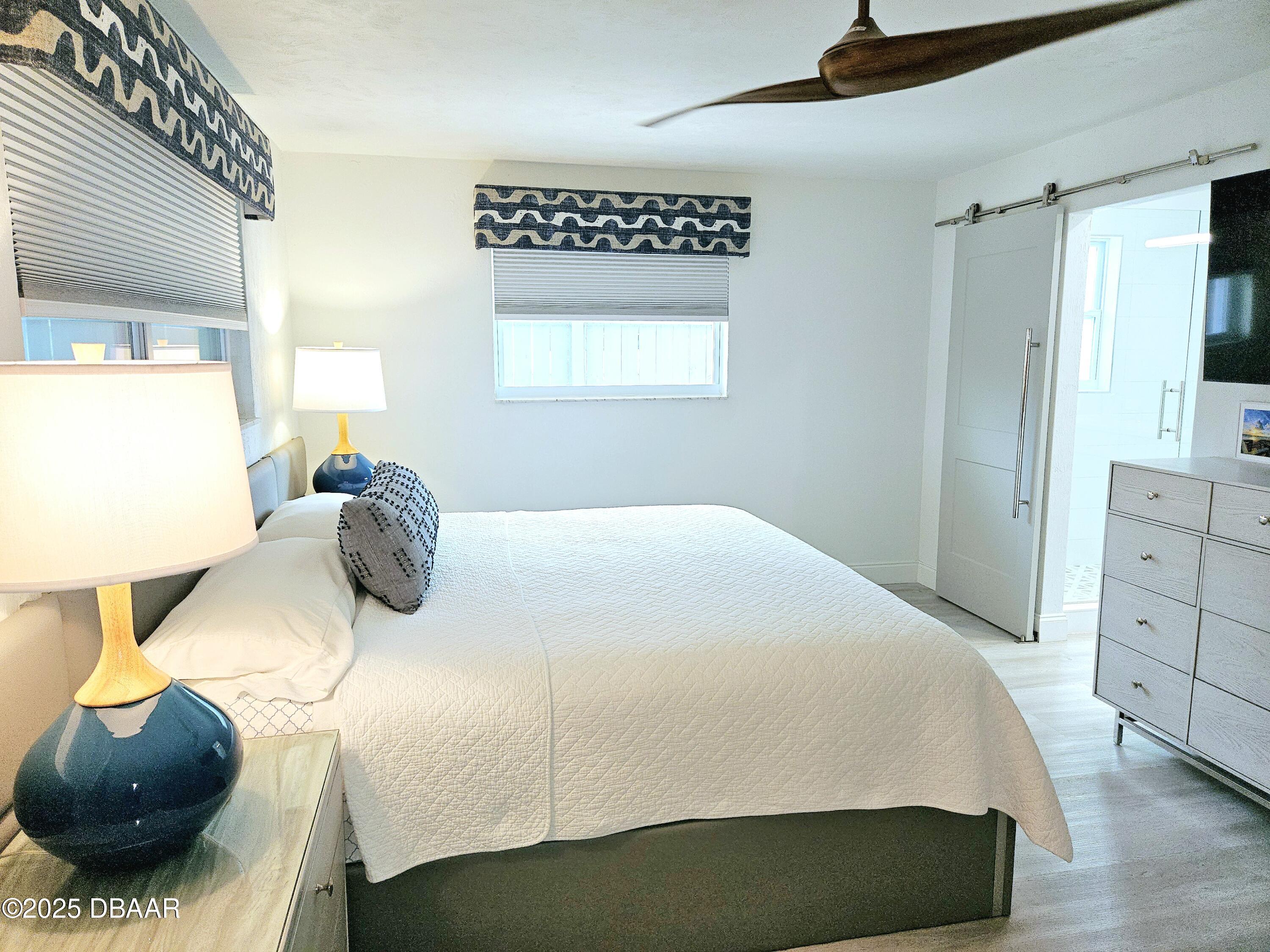 13 Sunrise Avenue Ormond Beach, FL 32176 - Photo 19 of 52 a bedroom with a bed and a dresser