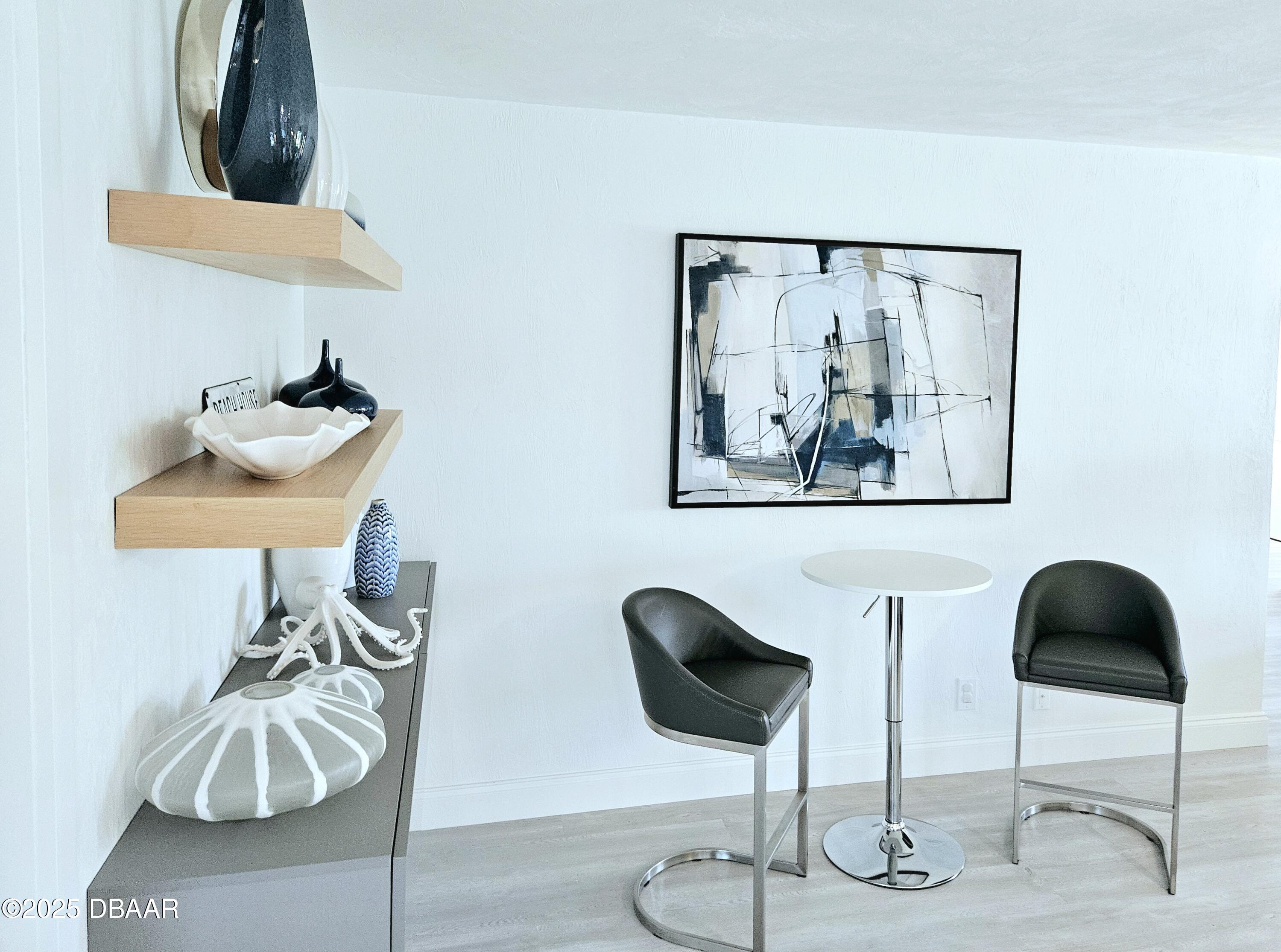 13 Sunrise Avenue Ormond Beach, FL 32176 - Photo 32 of 52 a view of a room with a flower pot and wooden floor