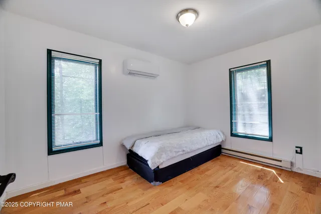 a room with a bed and window