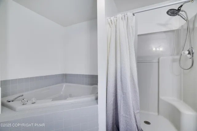 a bathroom with a sink vanity mirror and toilet